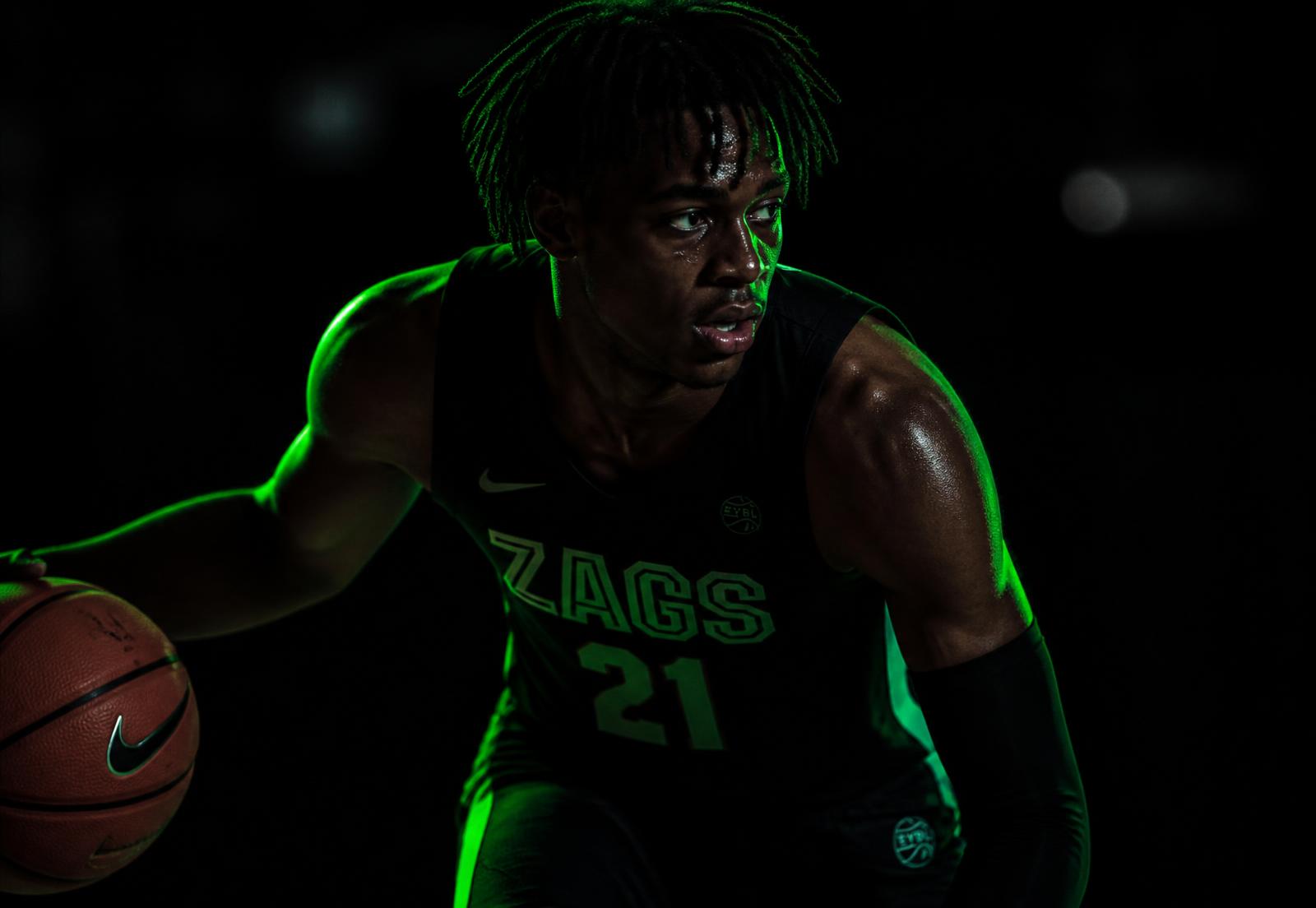 International basketball player training under neon light